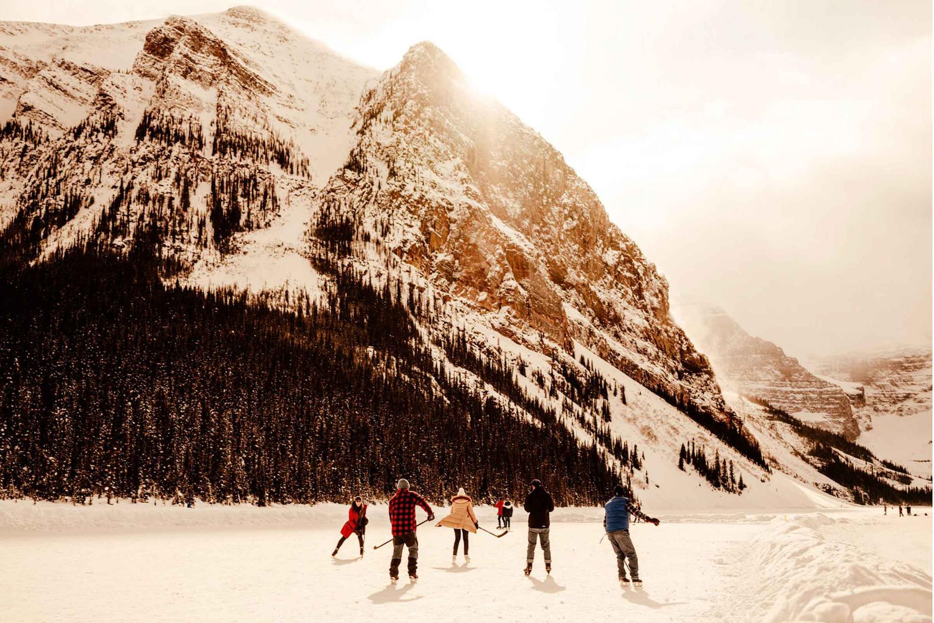 Skaters on a lake in Banff