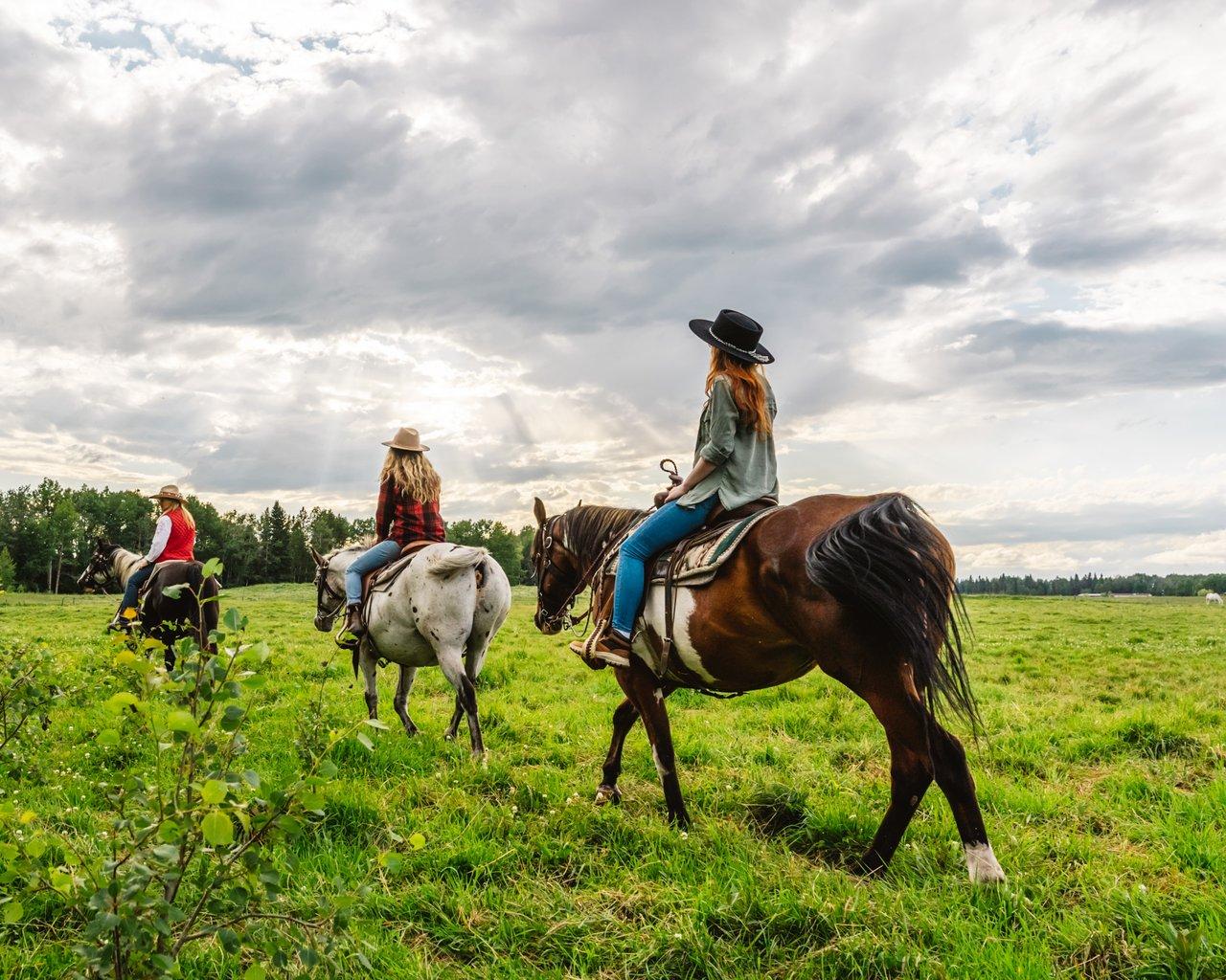 people riding horses on at Wildhorse Ranch