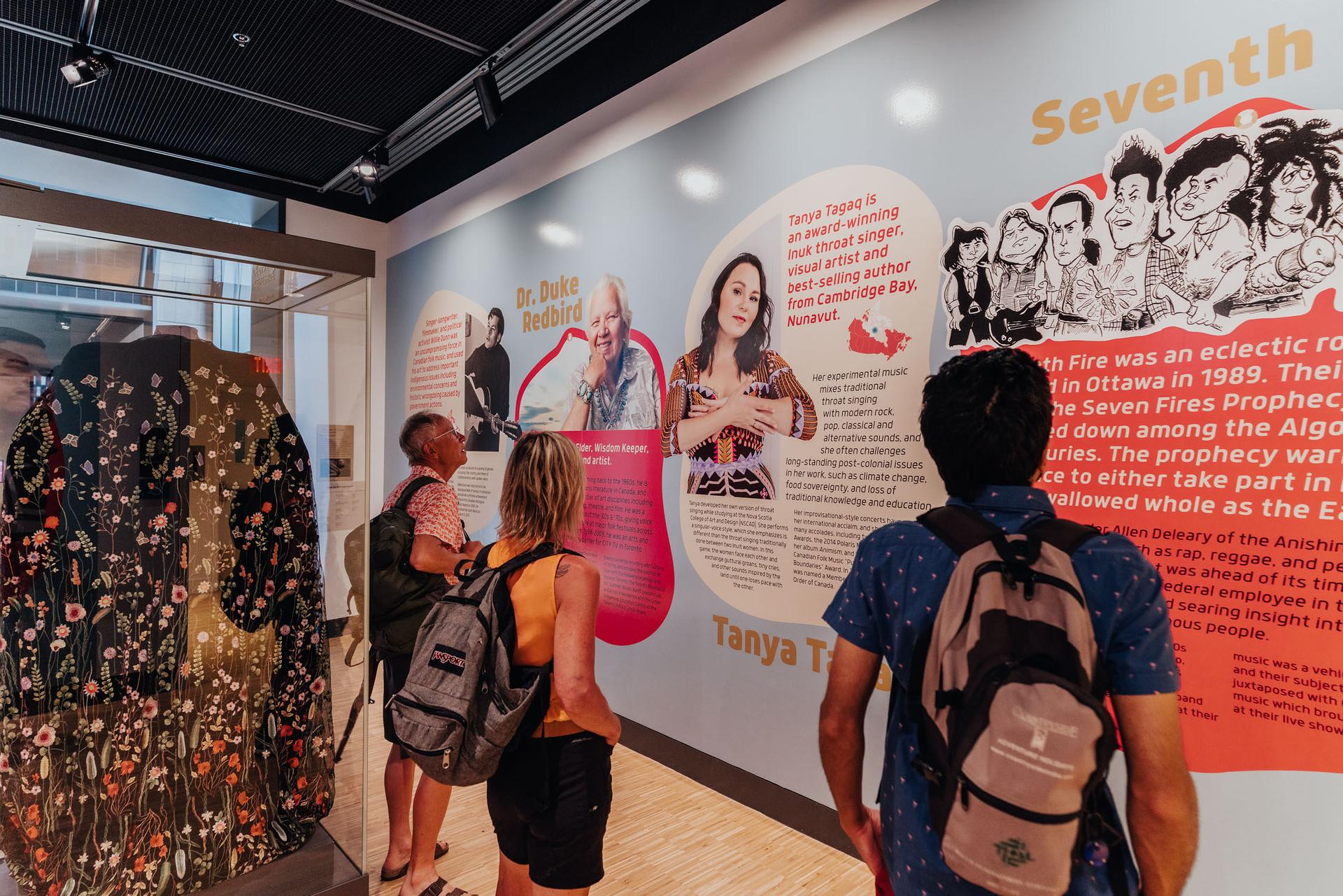 people looking at the speak up exhibit of the National Music Centre at Studio Bell