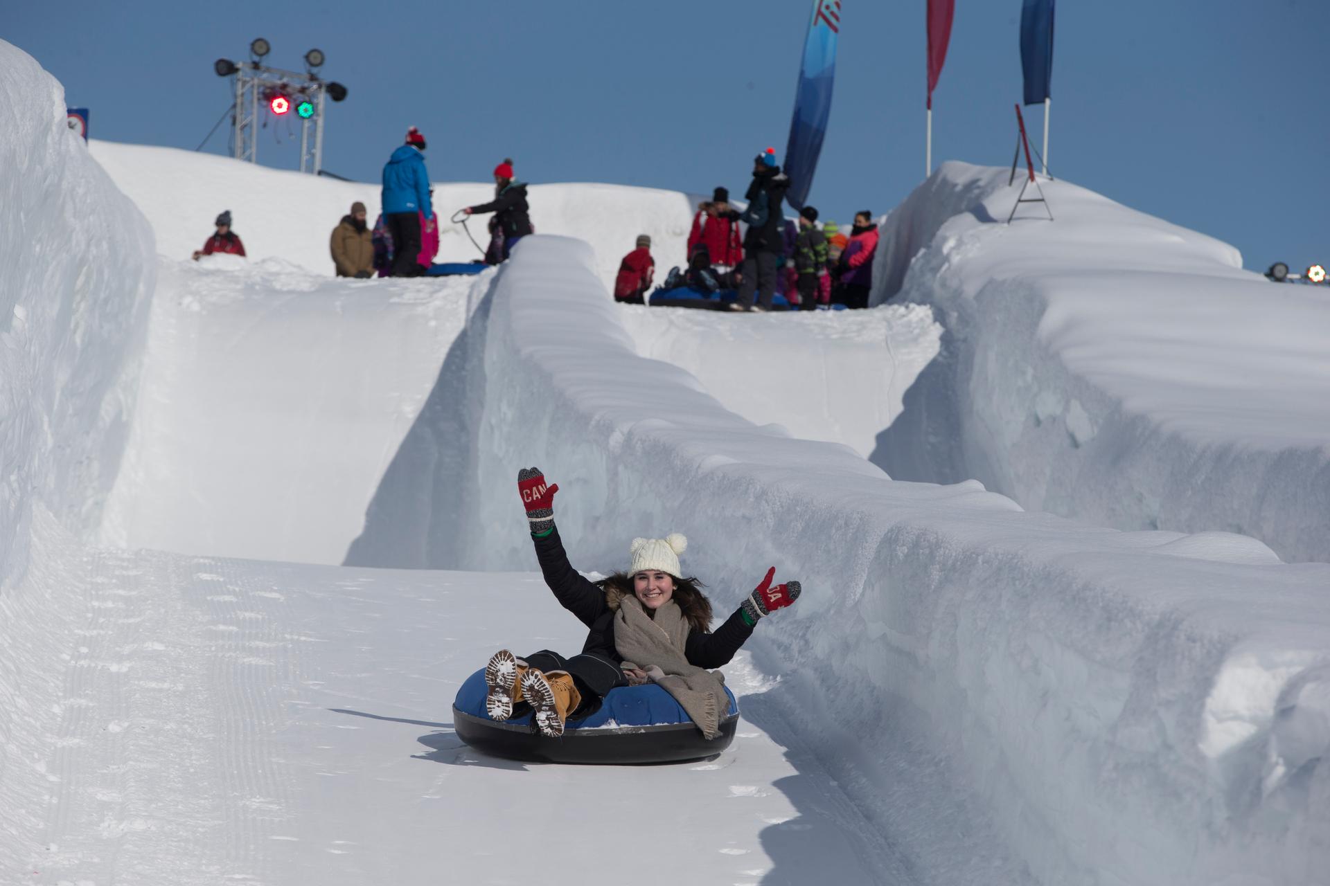 a person snowtubing at Winterlude in Ottawa