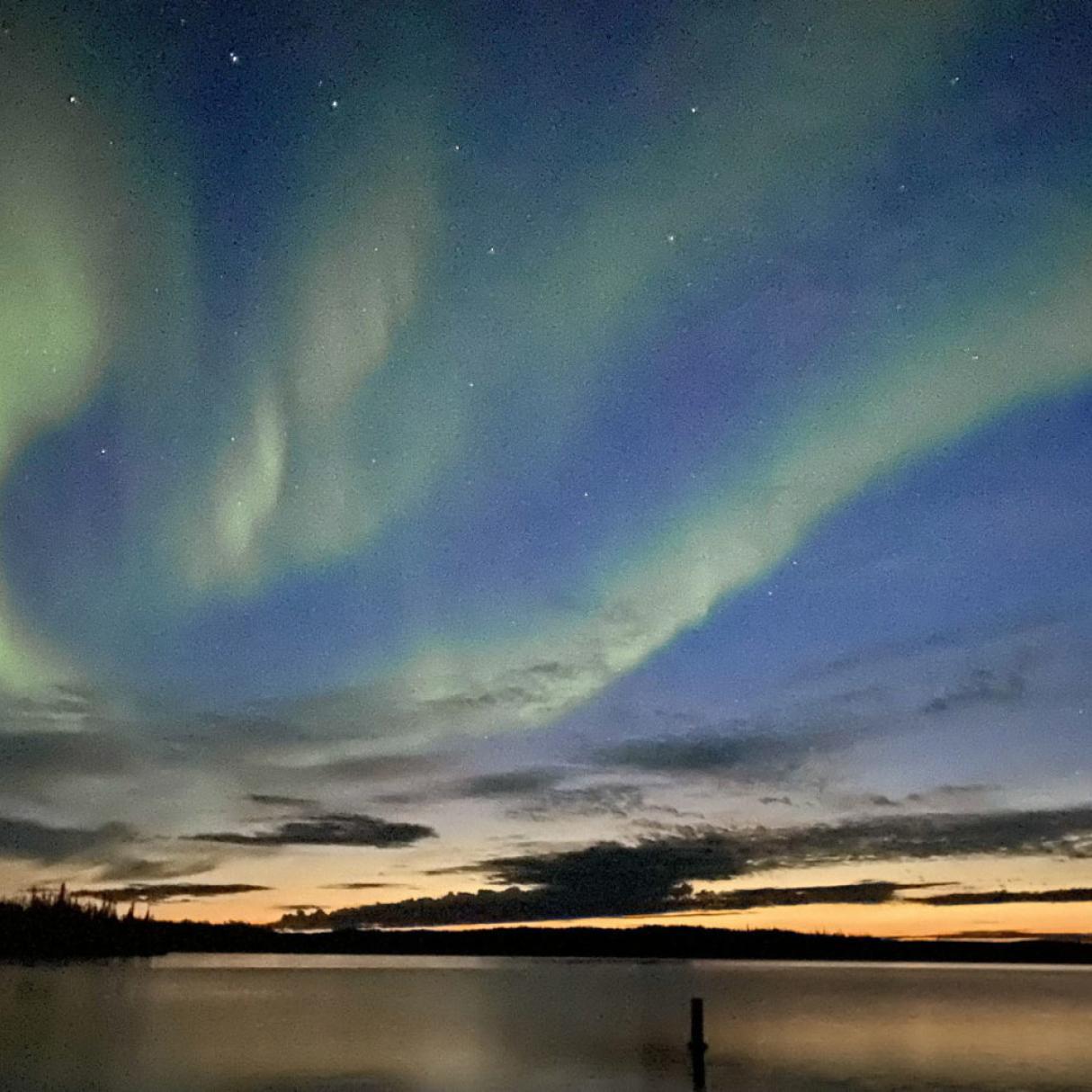 The Northern lights over a lake
