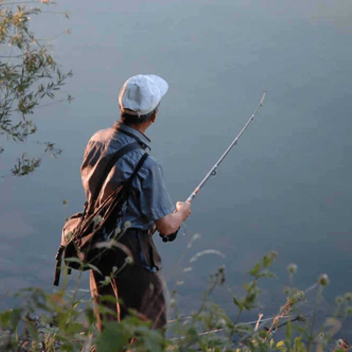 Man fishing in a body of water